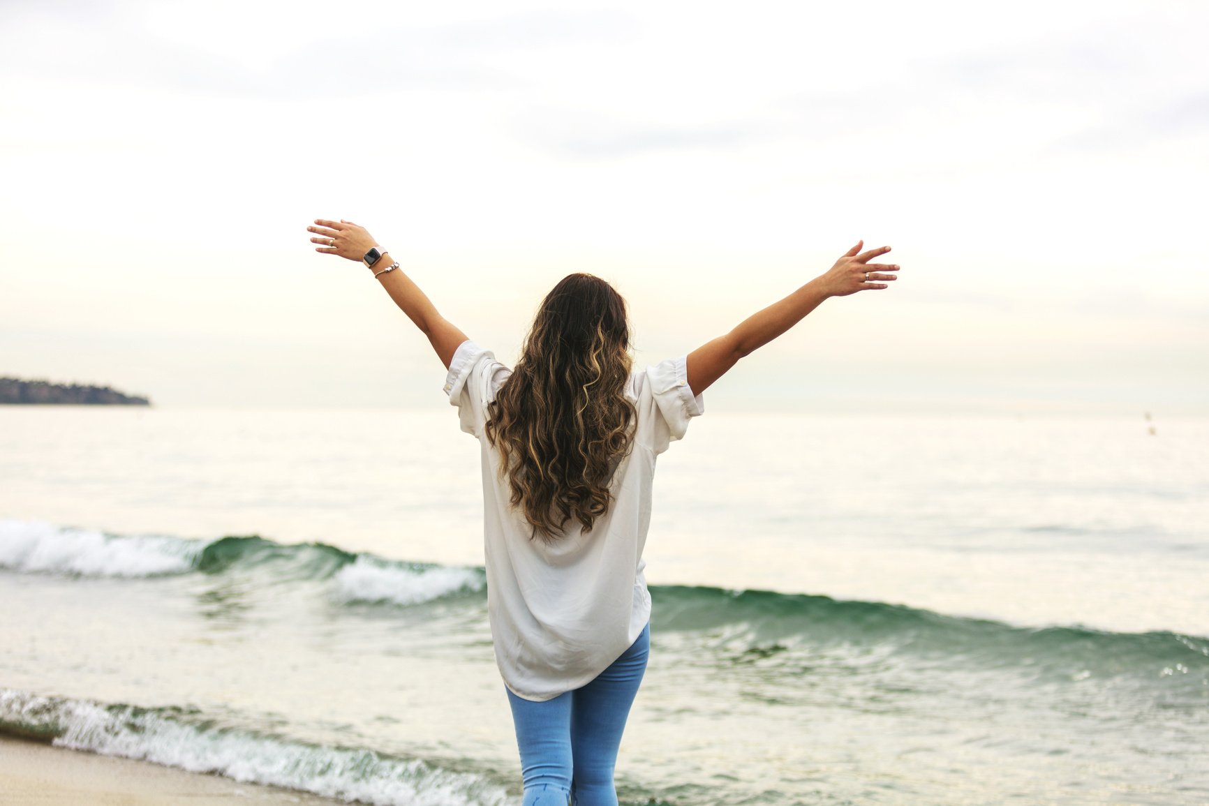 Female Millennial on Beach Exuberant and Full of Life Image Series