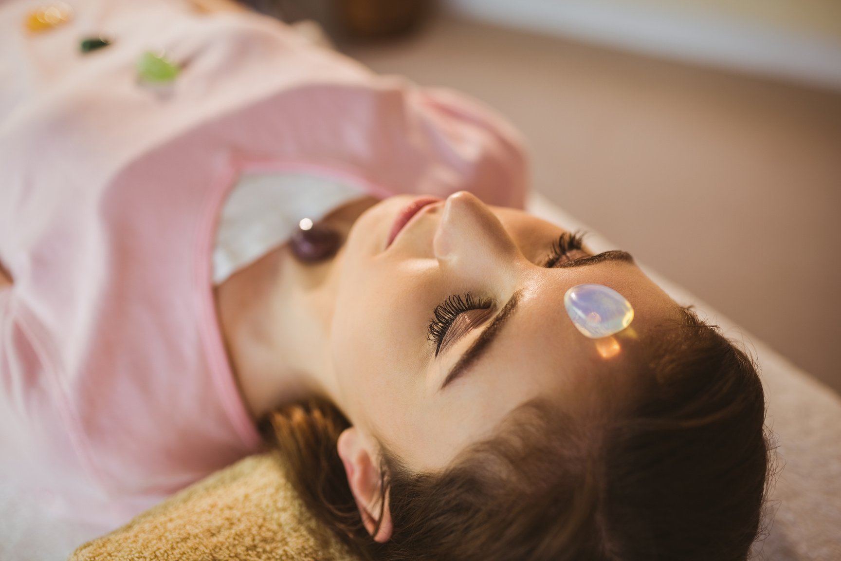 Young woman at crystal healing session